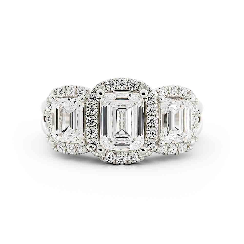 3 Emerald Cut Diamonds Surrounded By Cushion Shaped Diamond Halos