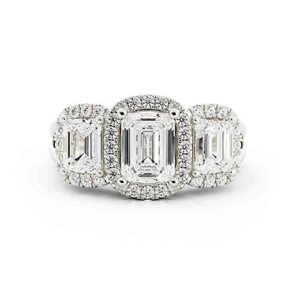 3 Emerald Cut Diamonds Surrounded By Cushion Shaped Diamond Halos