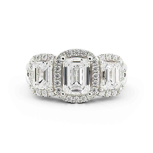 3 Emerald Cut Diamonds Surrounded By Cushion Shaped Diamond Halos