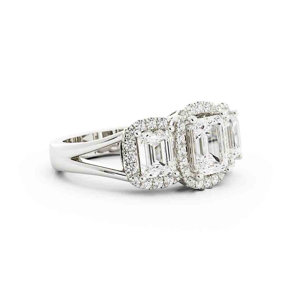 3 Emerald Cut Diamonds Surrounded By Cushion Shaped Diamond Halos