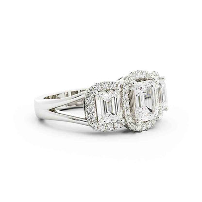 3 Emerald Cut Diamonds Surrounded By Cushion Shaped Diamond Halos