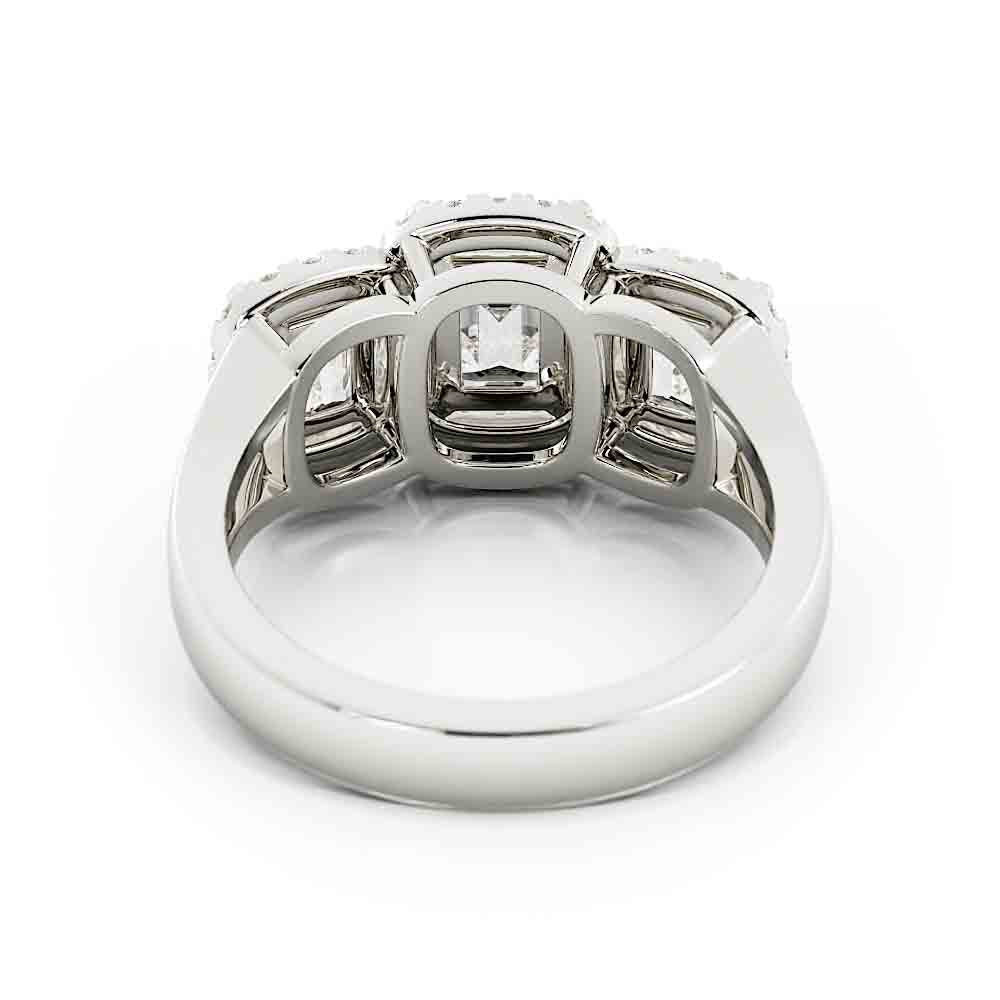 3 Emerald Cut Diamonds Surrounded By Cushion Shaped Diamond Halos