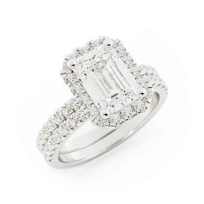 Emerald Cut Center with Halo and Rd Diamond Side stone