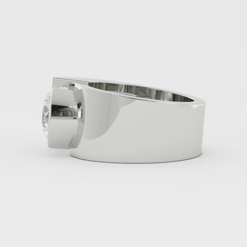 Video of a wide silver ring with a bezel-set diamond rotating on a white background