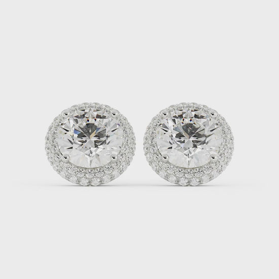 Video of diamond halo stud earrings on a white background