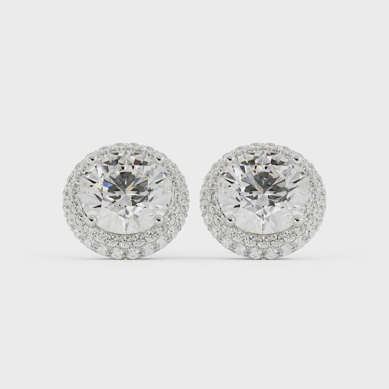 Video of diamond halo stud earrings on a white background